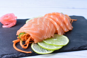 Japanese food, sashimi, with avocado, raw salmon, sesame, vegetables and caviar