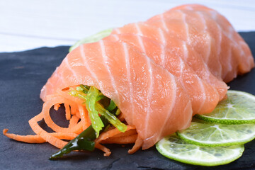Japanese food, sashimi, with avocado, raw salmon, sesame, vegetables and caviar