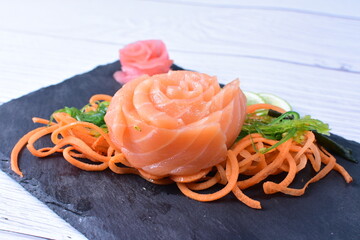 Japanese food, sashimi, with avocado, raw salmon, sesame, vegetables and caviar