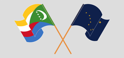 Crossed flags of the Comoros and the State of Alaska. Official colors. Correct proportion