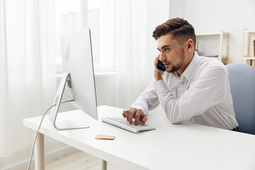 handsome man office worker in a white shirt emotions executive