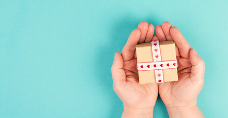 Little gift box with heart ribbon, copy space, background and greeting card for mother&acute;s day, valentine, father&acute;s day, birthday
