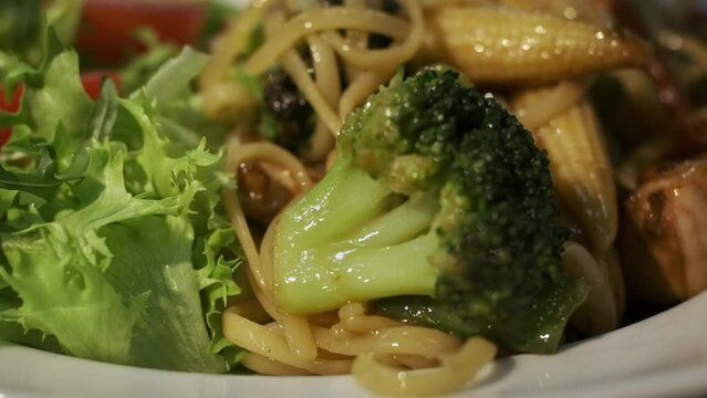 Warm Salad With Broccoli Corn Lettuce Arugula And Asparagus. Spaghetti And Tomatoes Are Great Addition To Salad.