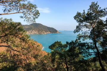 Mediterranean coast, mountains, islands, trees, blue water, Lekiy trail, summer, sunny day, no clouds, Turkey, Antalya, view from the sea.
