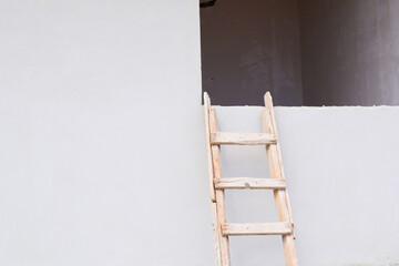 ladder on the gray wall