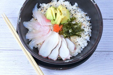 Japanese sashimi, rice, sesame, raw salmon, caviar and avocado