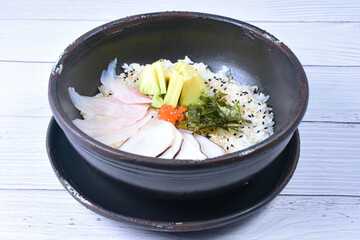 Japanese sashimi, rice, sesame, raw salmon, caviar and avocado
