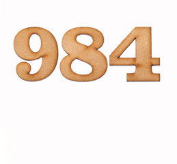 Number 984 in wood, isolated on white background