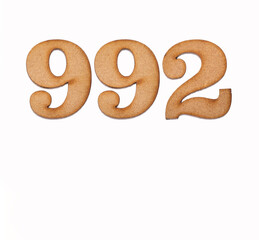 Number 992 in wood, isolated on white background