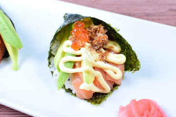 traditional japanese food, very colorful on white plate and sauce