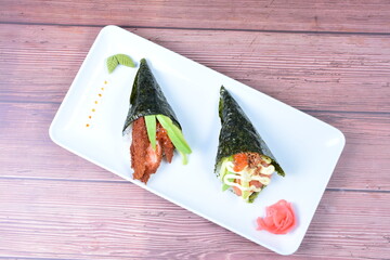 traditional japanese food, very colorful on white plate and sauce