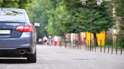 Close up of a car parked illegally against traffic rules on pedestrian city street side