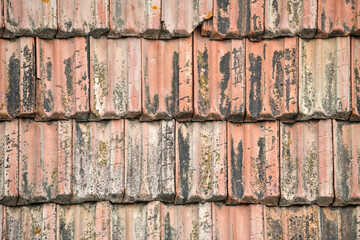 Closeup surface of old weathered ceramic tiles covering building roof