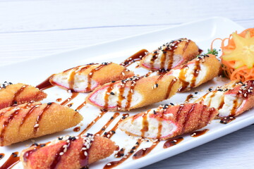 traditional Japanese food appetizer, with soy sauce, sesame seeds, vegetables