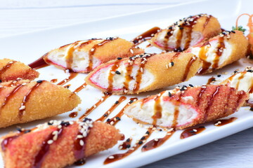 traditional Japanese food appetizer, with soy sauce, sesame seeds, vegetables