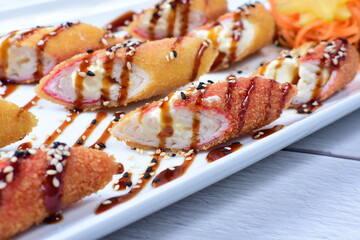 traditional Japanese food appetizer, with soy sauce, sesame seeds, vegetables