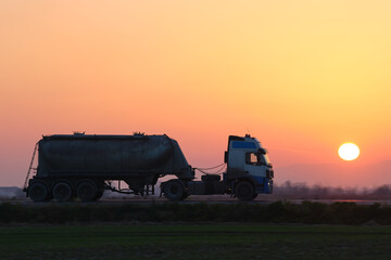 Petrol cargo truck driving on highway hauling oil products. Delivery transportation and logistics...