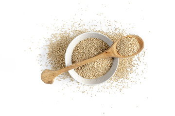 Quinoa bowl accompanied by a wooden spoon on a white background.