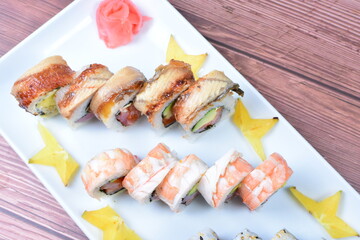 Traditional colorful suhi, cream cheese, salmon, caviar, rool sishi crunch, sesame seeds and sauce