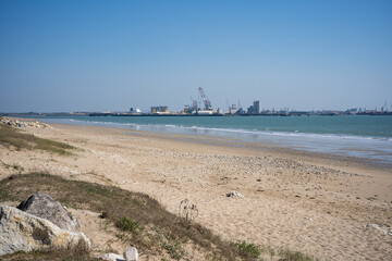 View of La Pallice, the trade port of La Rochelle. freight ships and cranes in the trade port