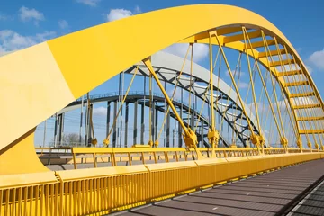 Gordijnen Hogeweiderbug (yellow bridge) in Utrecht over the Amsterdam Rhine Canal near the Schepenbuurt next to the Vleutense Brug © R