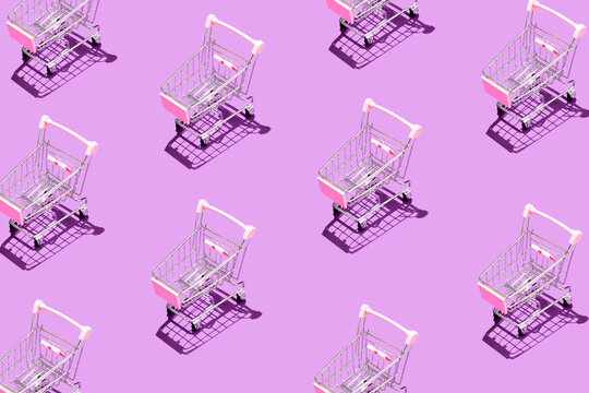 Pattern of supermarket shopping cart on purple background. Creative design for packaging. Online shopping. Seamless pattern. Black friday sale concept. Copy space. Sustainable, minimalist lifestyle.