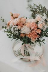 Wedding bouquet of the bride in peach shades