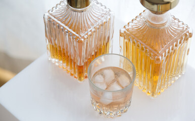 Luxury glass bottles with different alcoholic spirits inside, copy space photo