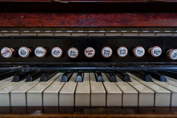 Fototapeta na wymiar An old piano, closeup of keys, music instrument