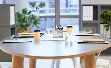 Looks like the meetings been adjourned. Shot of a well-lit modern office boardroom with nobody in...