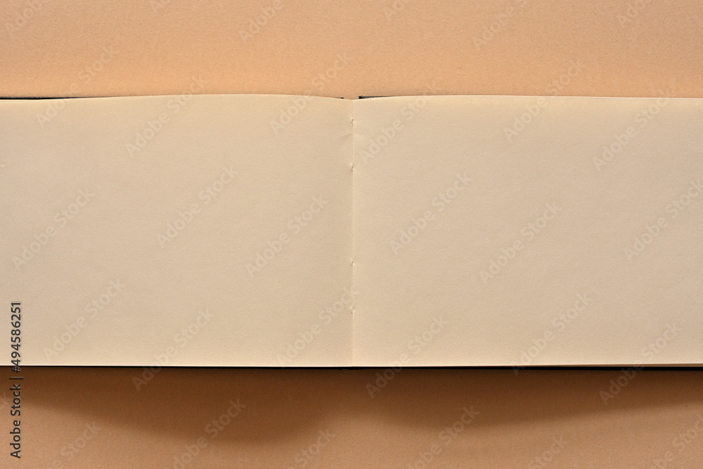 Poster an open white notebook is placed in the upper right corner of the screen. there is a large copy spac