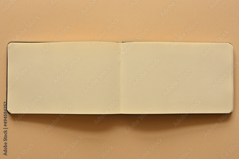 Poster an open white notebook is placed in the upper right corner of the screen. there is a large copy spac