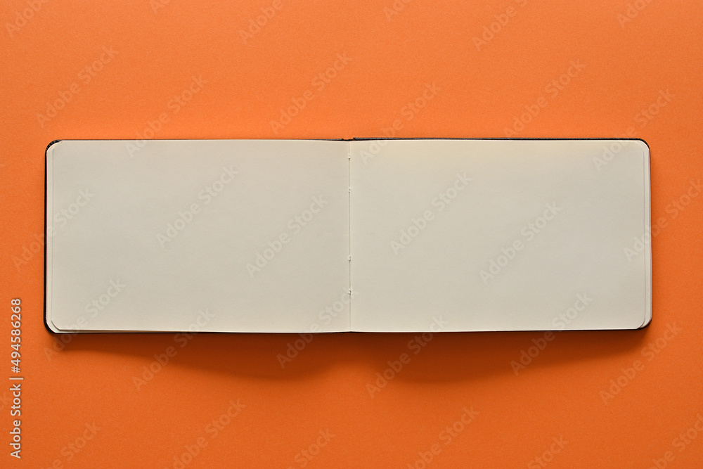 Poster an open white notebook is placed in the upper right corner of the screen. there is a large copy spac