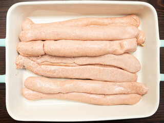 Fresh, raw Thuringian sausages are recommended for the grill. Bratwursts taste good to everyone. Top shot of fresh sausages.
