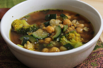 Close up of Bowl of Soup With Garbanzo Beans, Broccoli and Zucchini