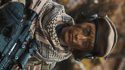 Vertical Video - British armed forces lady soldier guarding pose - career options for women in army. High quality 4k footage - Powered by Adobe