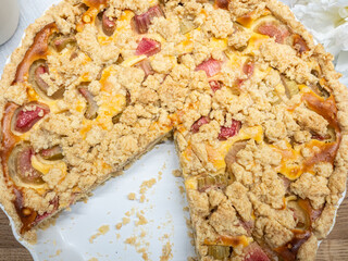 Close-up of a delicious rhubarb crumble cake. The smell of freshly baked cake is in the air....