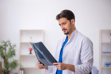 Young male doctor radiologist working in the clinic