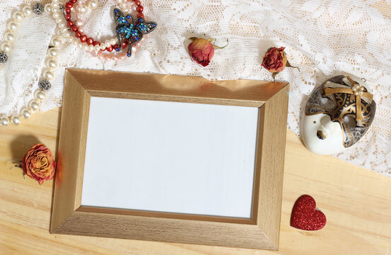 Pearl Jewelry and Butterfly Broach With Lace and Dried Roses surrounding photo frame