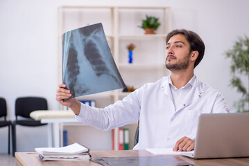 Young male doctor radiologist working in the clinic