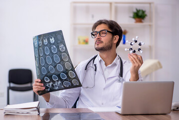 Young male doctor radiologist working in the clinic