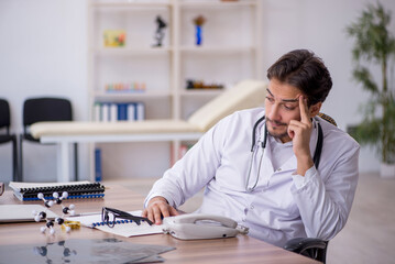 Young male doctor working in the clinic