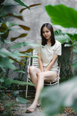 young Asian woman person are happy and enjoy in the garden, nature space to relaxation in holiday, eco cafe outdoor