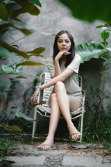 young Asian woman person are happy and enjoy in the garden, nature space to relaxation in holiday, eco cafe outdoor