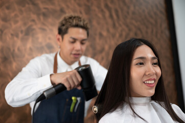 woman client person having a process to making treatment a hair with hairdresser in beauty salon