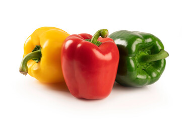 Red yellow and green peppers isolated on white background.