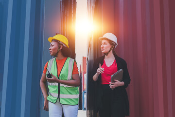 Team worker American women Work in an international shipping yard area Export and import delivery...