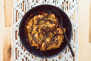 vegan couscous with butter beans topped with sundried tomatoes and Moroccan spices, healthy plant-based food