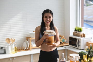 healthy food lifestyle of Asian woman with Kombucha tea drink, natural organic scoby pro biotic