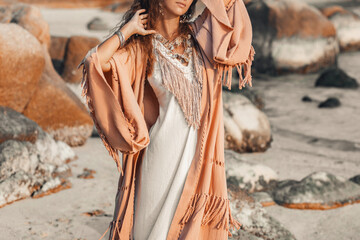 beautiful young stylish woman on the beach